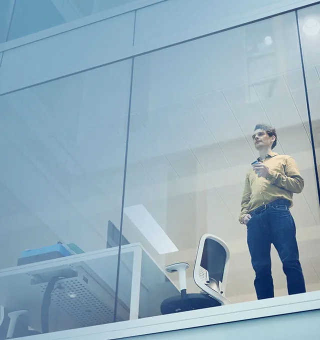  Business owner looking from the office
